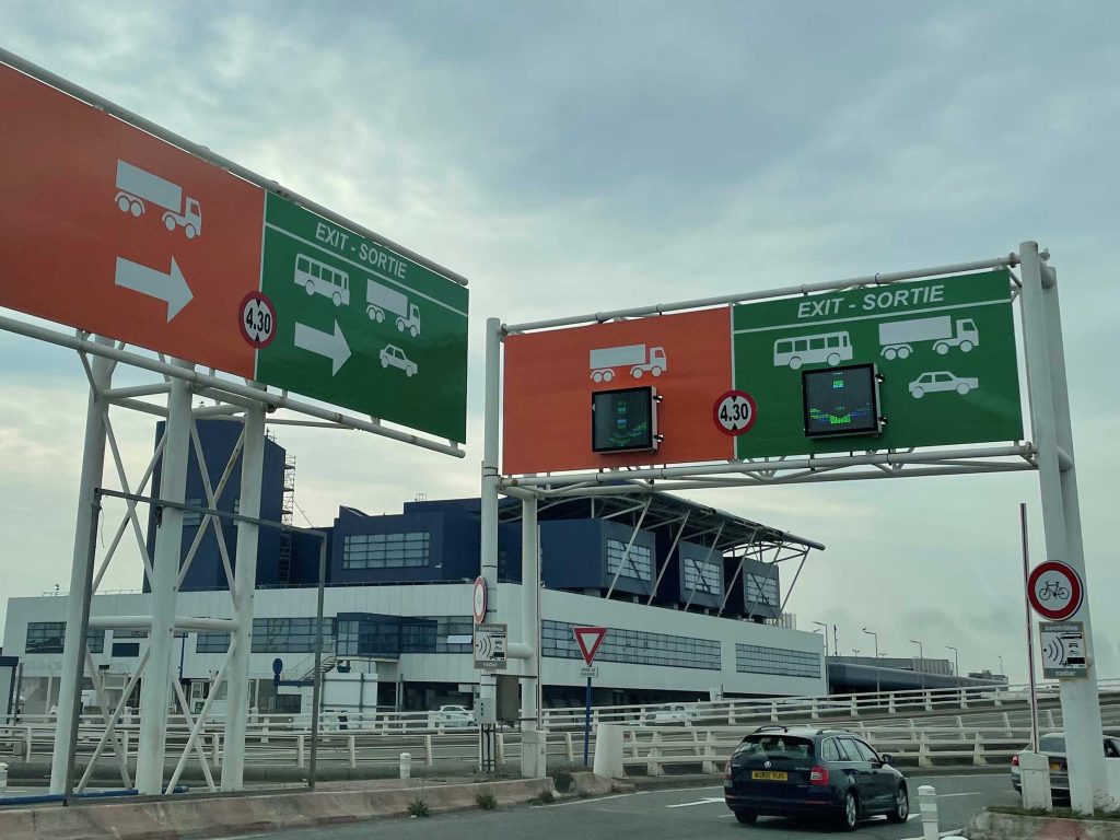 Calais port, green and orange route for vehicles disembarking ferry from Dover.